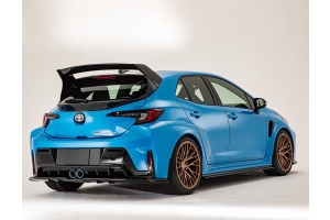 Blue Toyota GR Corolla with GROW Design rear wing, rear diffuser and side spoilers, rear three-quarter view