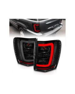 ANZO 1999-2004 Jeep Grand Cherokee LED Tail Lights w/ Light Bar Black Housing Smoke Lens - 311395