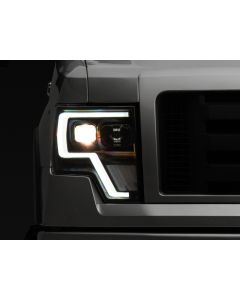 Raxiom 09-14 Ford F-150 G4 Projector Headlights- Black Housing (Clear Lens) - T544003